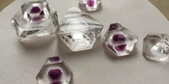 Clear crystals containing purple centers